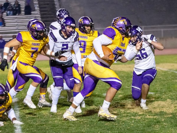 Lemoore defensive standout Isaiah Morales rambles for a touchdown after the Tigers came up with a blocked punt against Washington Union.